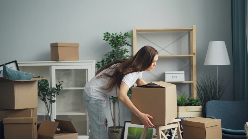Woman reflecting on anxiety about moving to a new home